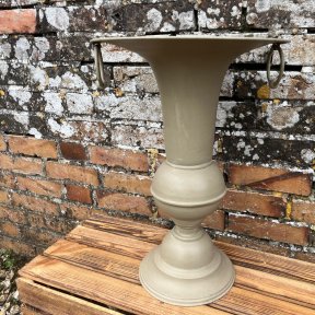 Narrow metal urn